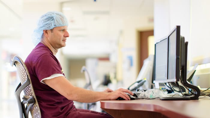 clinician looking at computer screen