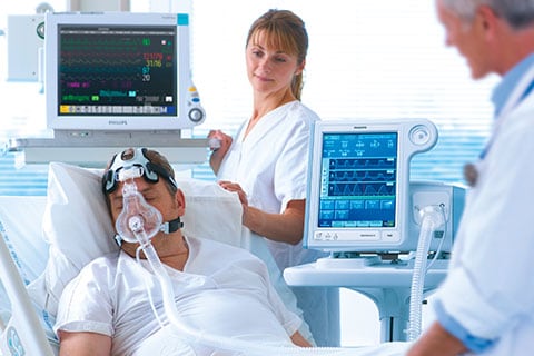 A patient on a respioratory face mask. Hospital acquired infections can be reduced by pre-emptive action