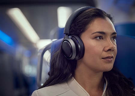 Woman enjoying Noise Cancelling Pro+ with Philips L4 headphones