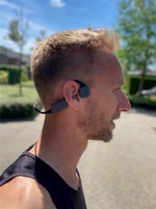 Runner man with bone conduction headphones